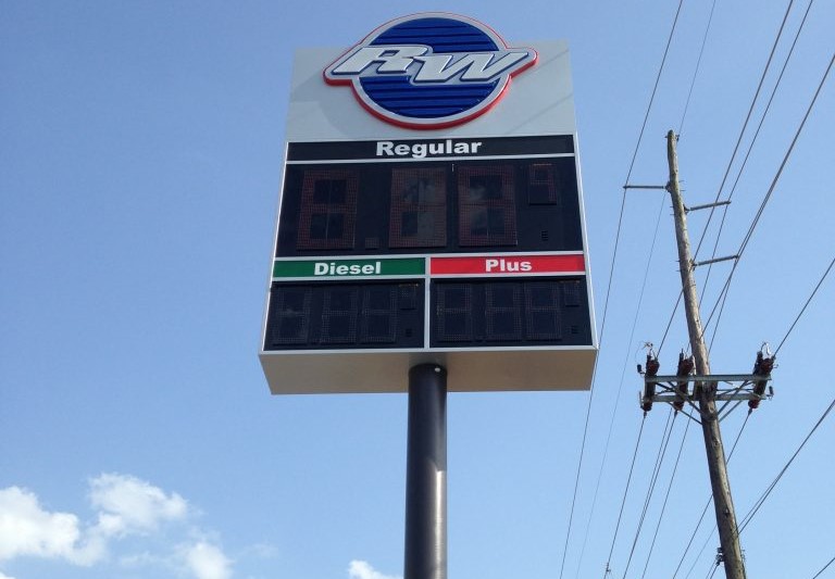 Pole sign for a gas station with a digital price display.