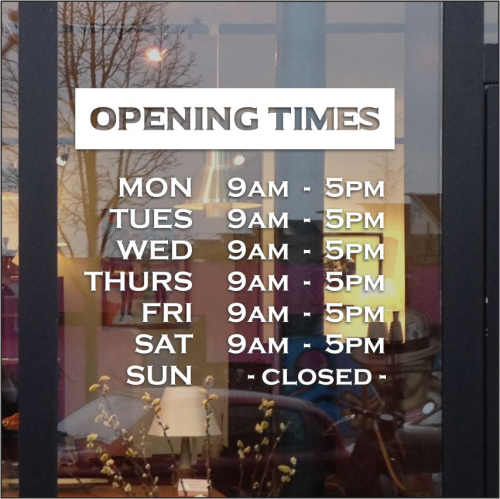 Retail window sign with store hours