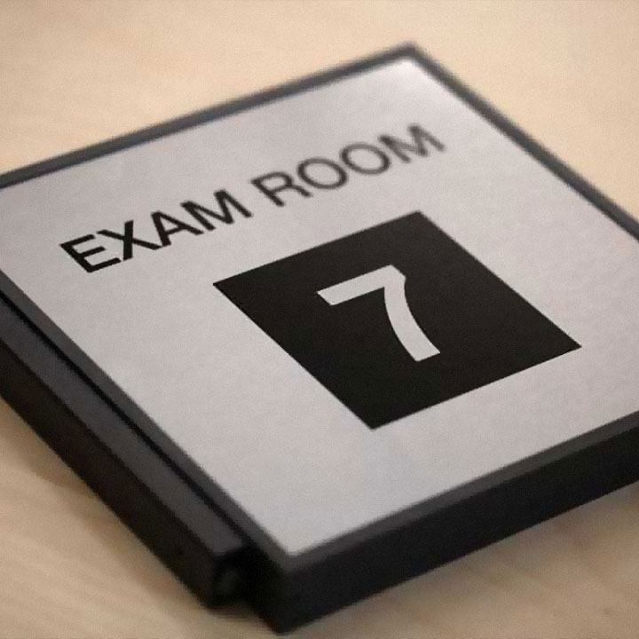 Wayfinding sign indicating exam room 7