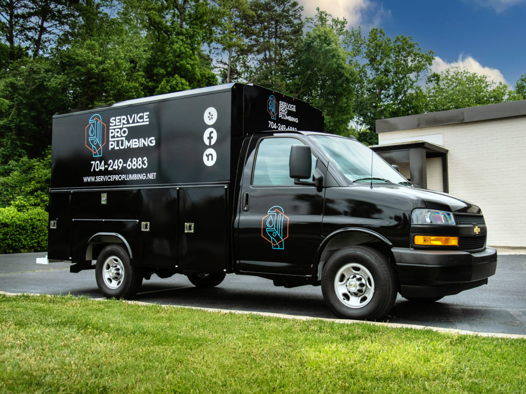 Cast vinyl wrap with cut lettering on top.