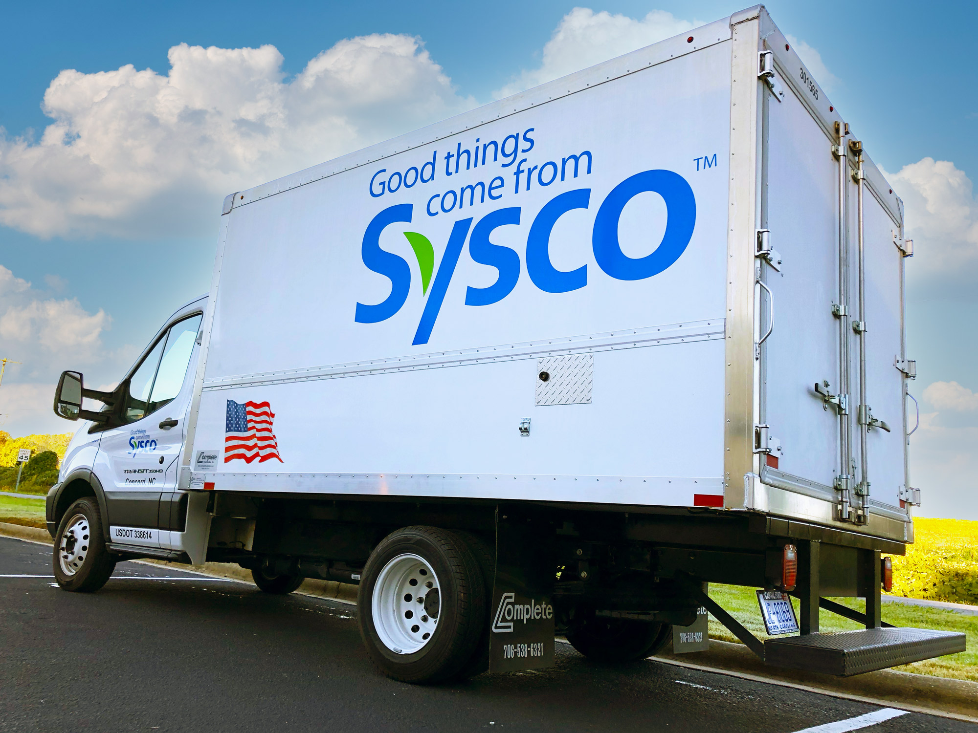 Box truck with vinyl lettering.