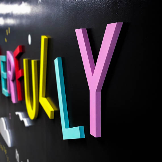 Letters were cut from PVC and painted to match the bright pastel palette.