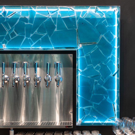 Creative microbrewery taproom backsplash.